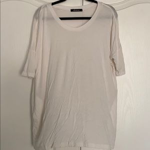 White soft shirt with pockets.